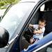 Ann Arbor resident Taysir Husain, 3, plays in the front of a Pittsfield police cruiser during the Pee Wee Olympics on Sunday, June 9. Daniel Brenner I AnnArbor.com